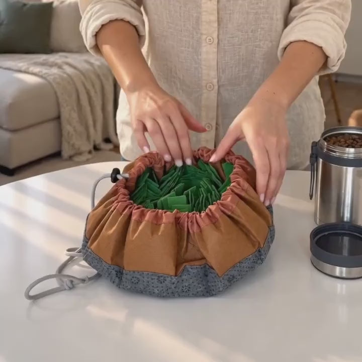 Dog searching the fleece of a green adjustable snuffle mat
