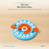 Round interactive dog puzzle board with white sliding paw-print lids, an orange spinning center, and a pull-out drawer hiding treats