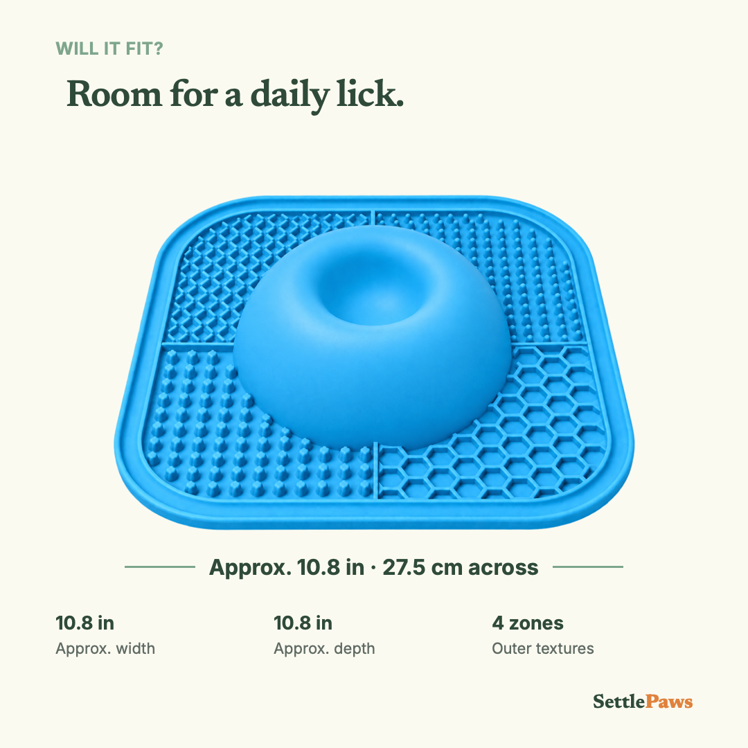 Blue silicone dog lick mat with four textured areas and smooth raised center, approximately 10.8 inches across
